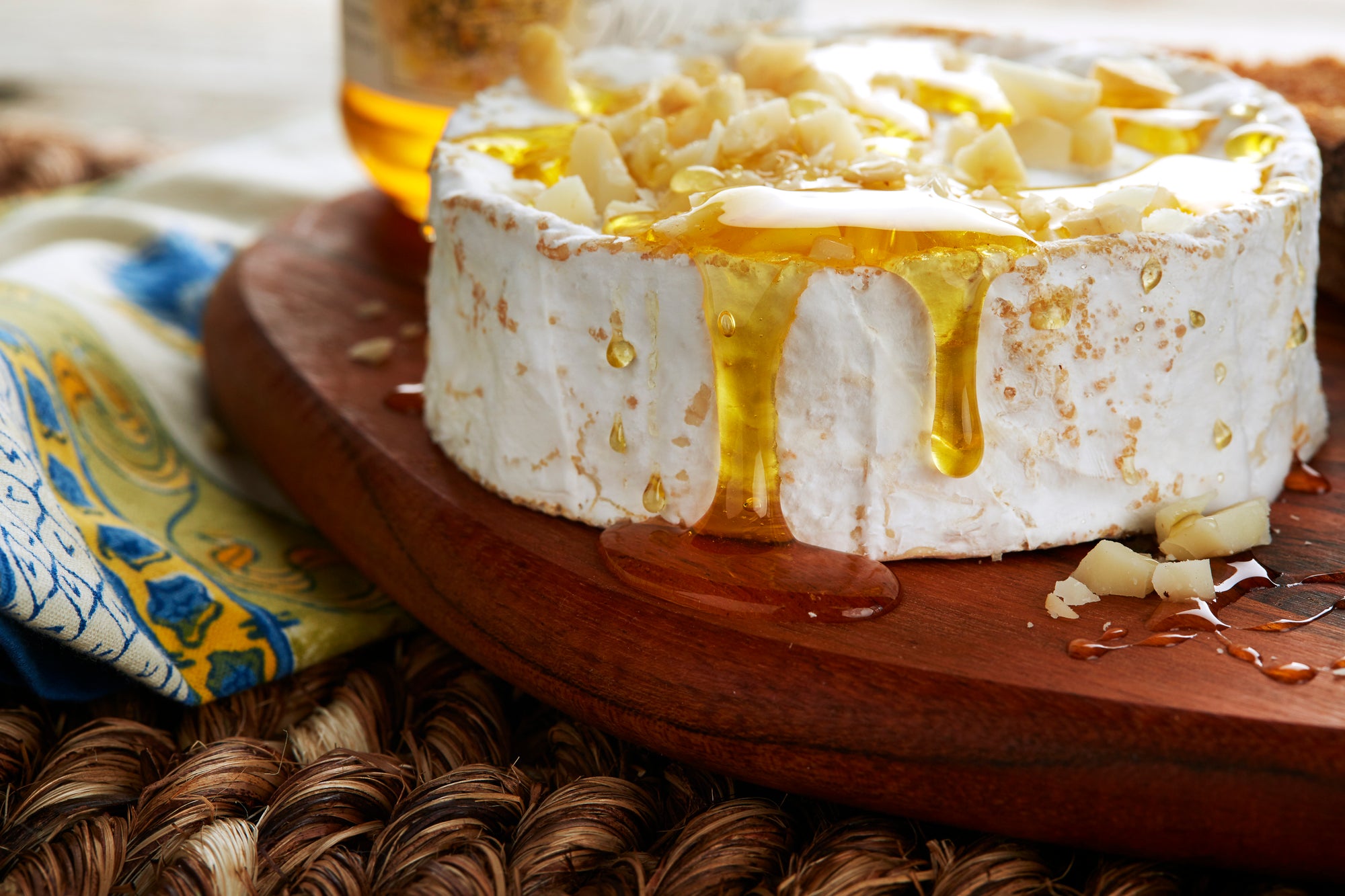 wilelaiki honey poured over brie cheese